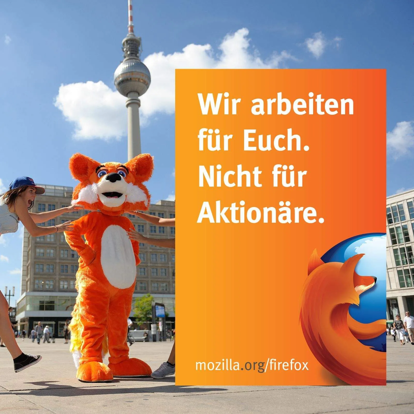 Firefox mascot in front of a campaign poster on Alexanderplatz, Berlin