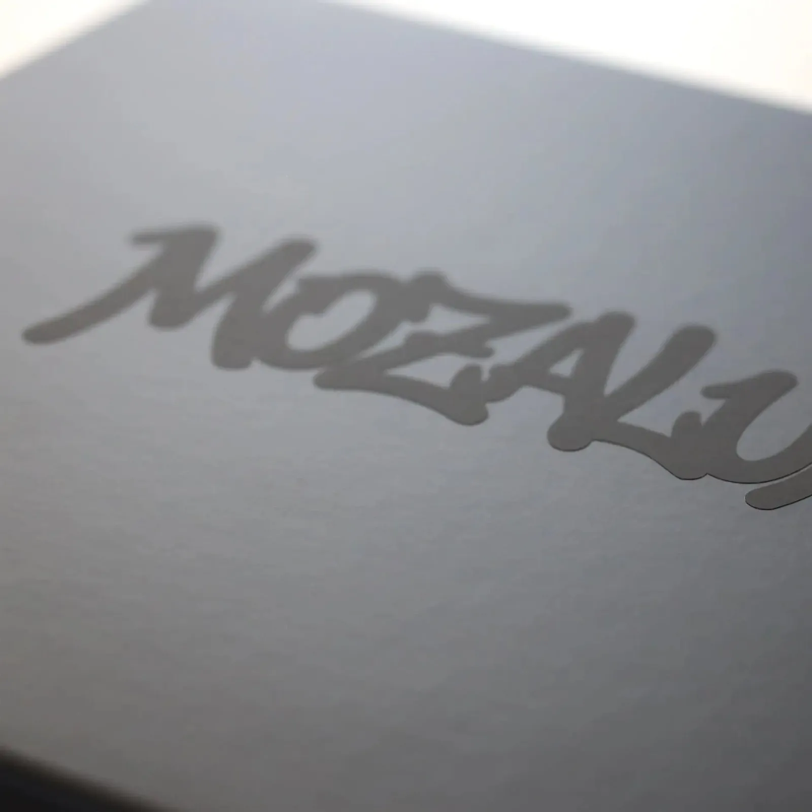 Mozilla Alumni wordmark embossed on paper
